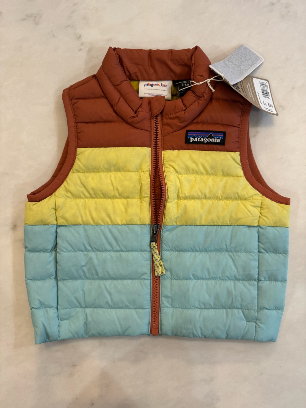 NWT Patagonia Colorblock Down Vest in Aqua, Yellow & Rust